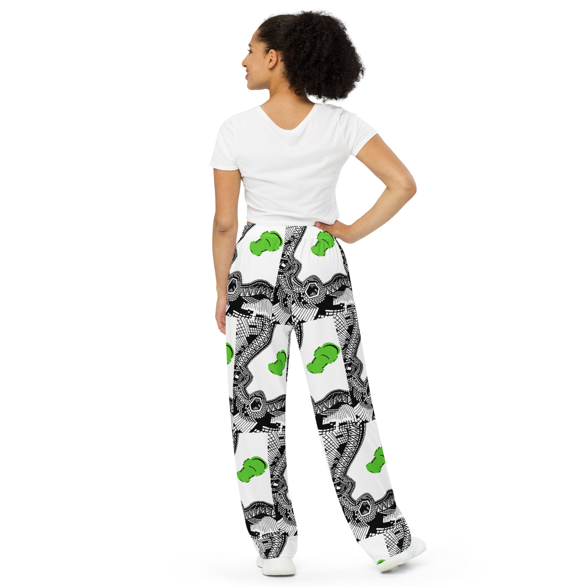 Back side. Urban City Wheels Signal wide-leg pants with an abstract black-and-white pattern and flying green skateboards.