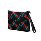 Black crossbody bag featuring an abstract skateboard graphic in black, red and cyan.