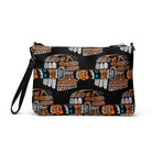 Black crossbody bag with a repeating Carnivore Skate Fridge print in orange, turquoise and grey.