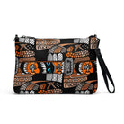 Black crossbody bag with a repeating Carnivore Skate Fridge print in orange, turquoise and grey.