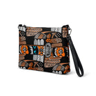 Black crossbody bag with a repeating Carnivore Skate Fridge print in orange, turquoise and grey.
