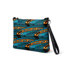 Crossbody bag featuring the abstract Jetfin Reef shark graphic in turquoise, orange and black.