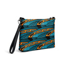 Crossbody bag featuring the abstract Jetfin Reef shark graphic in turquoise, orange and black.