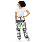 Back side. Urban City Wheels Signal wide-leg pants with an abstract black-and-white pattern and flying green skateboards.