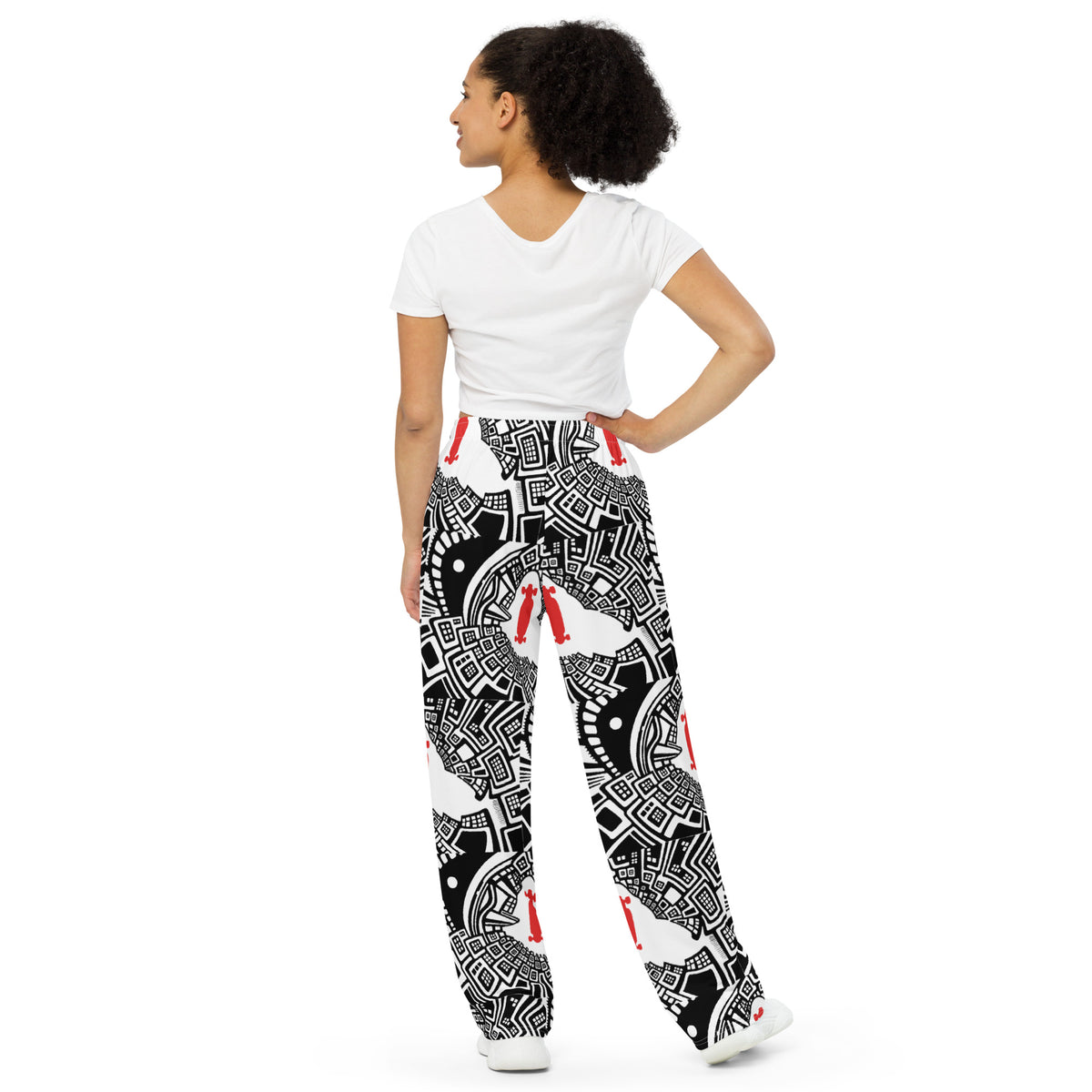 Back side. Urban Highrise Signal wide-leg pants with an abstract black-and-white city pattern and red skateboard motifs.