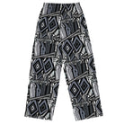 Back. Wide-leg trousers featuring an all-over repeating abstract skateboard and wood-grain graphic pattern rendered in monochrome black, grey, and white tones.